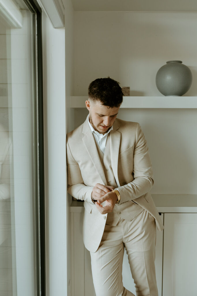 groom getting ready before ceremony 