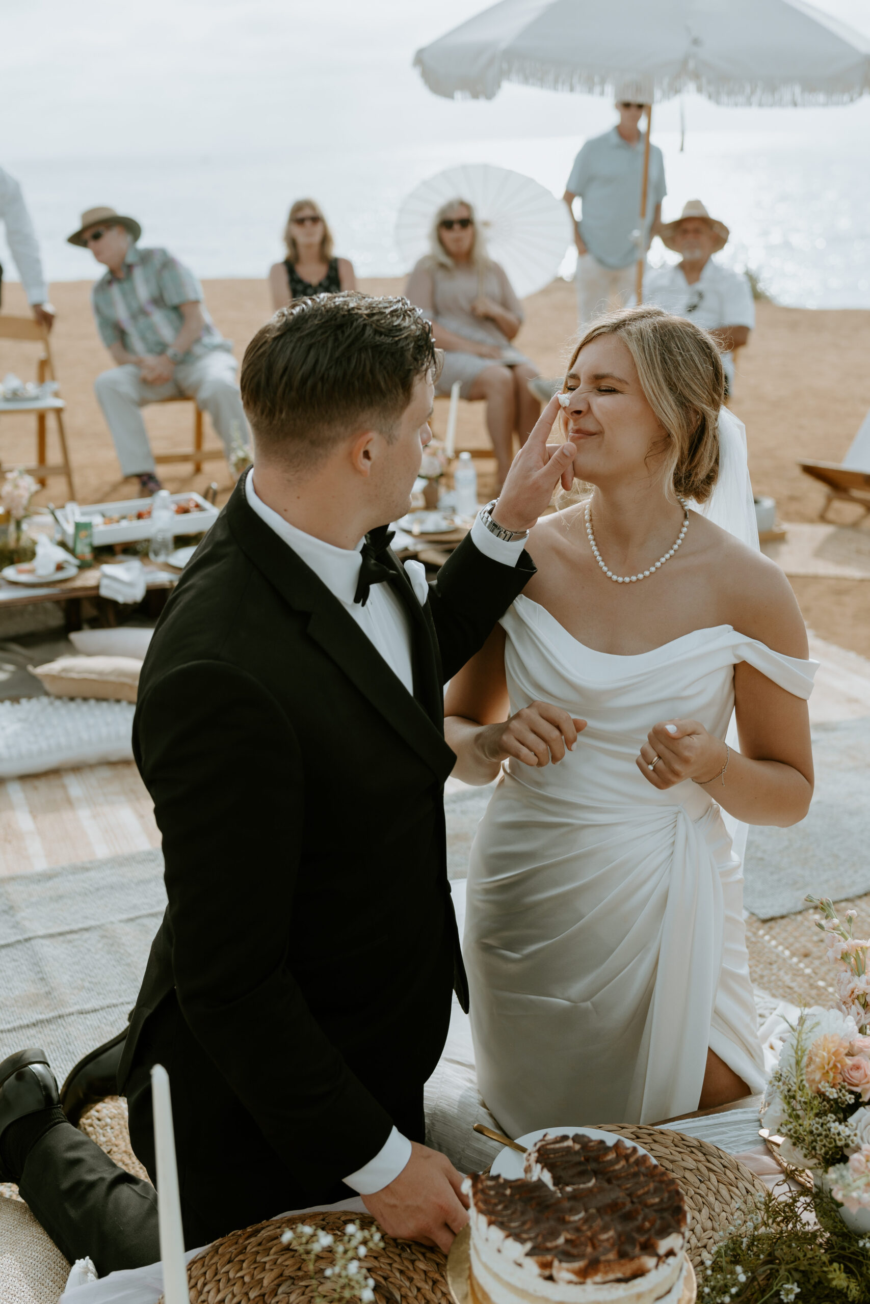 bride and groom sharing their first slice of cake after wedding ceremony