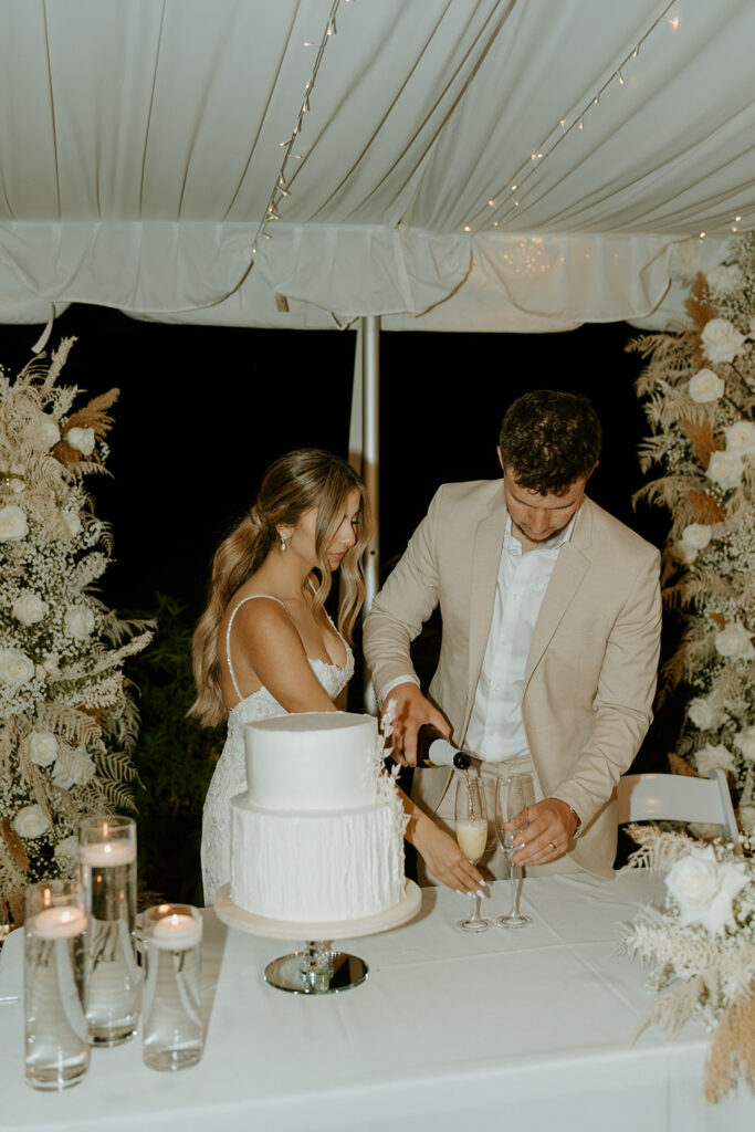 bride and groom toasting and cutting cake