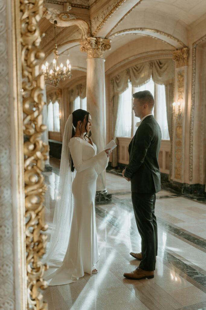 bride and groom reading private vows for courthouse elopement ceremony