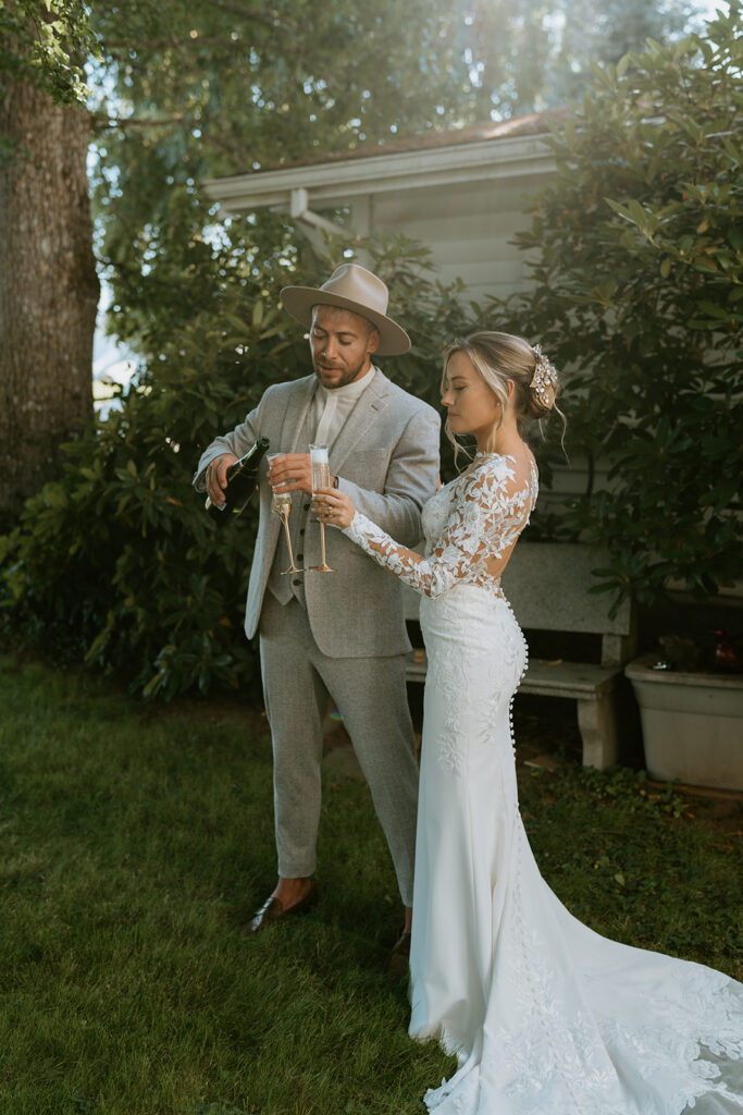 bride and groom having champagne toast