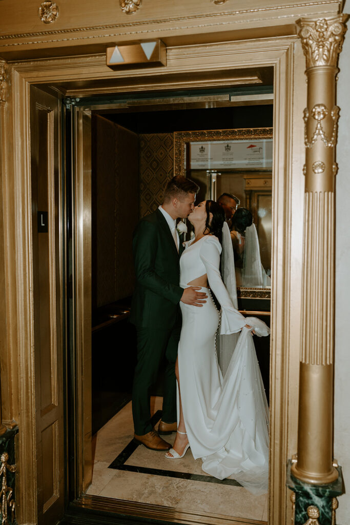 bride and groom in an elevator