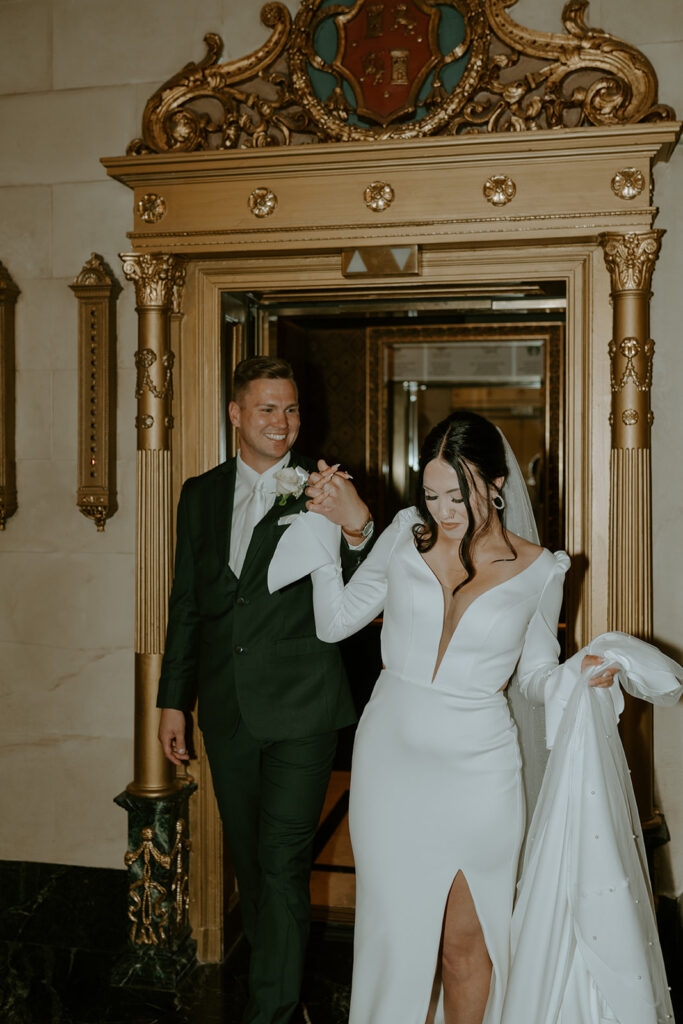 bride and groom in an elevator