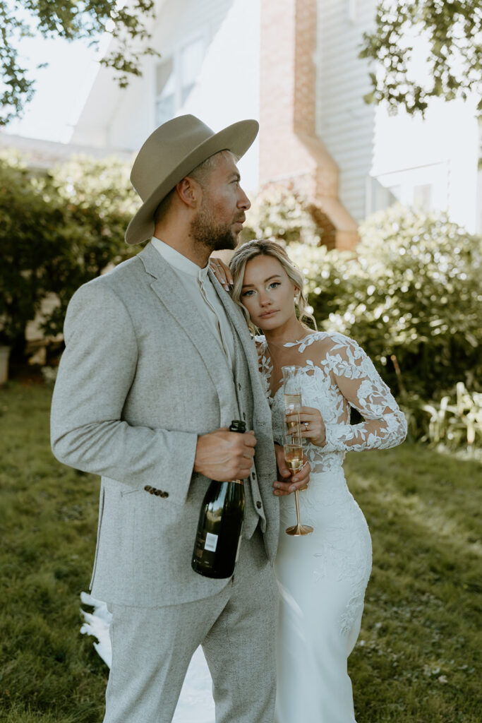 bride and groom having champagne toast