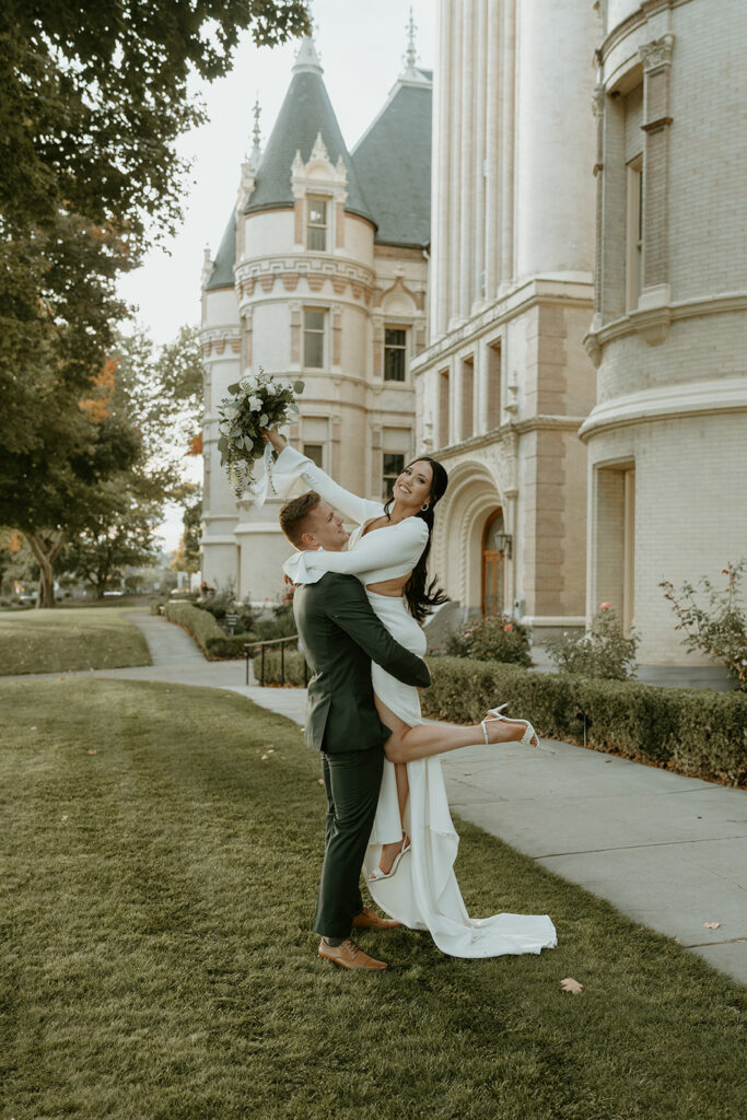 bride and groom standing outside of The Historic Davenport