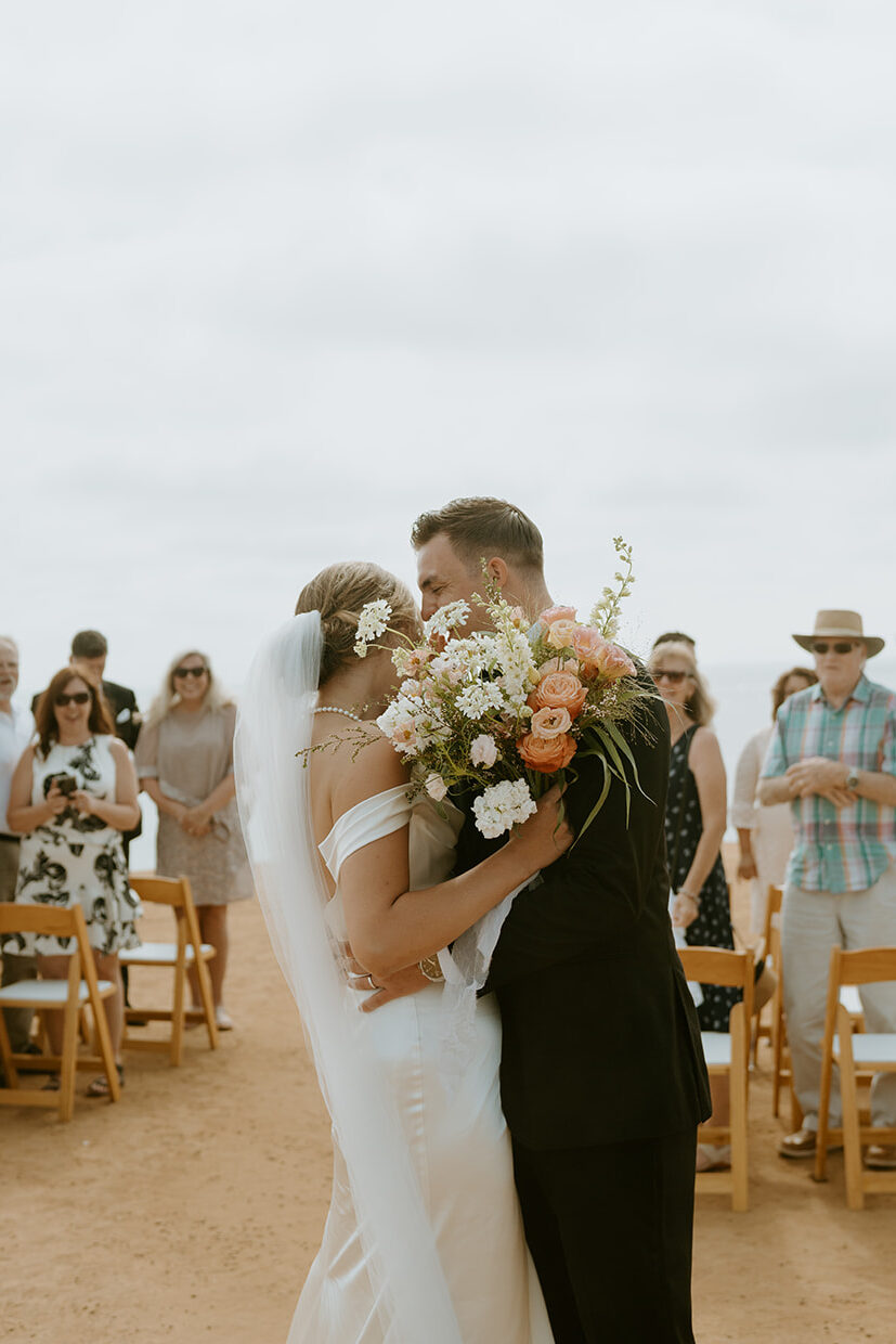 bride and groom kiss after micro wedding ceremony