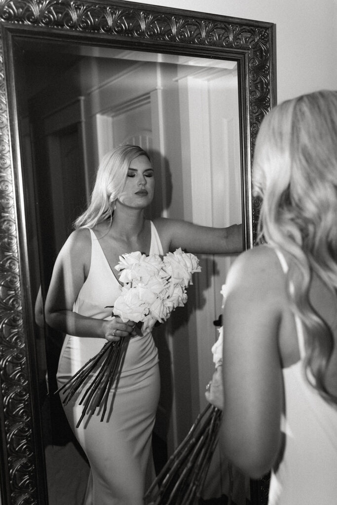 Creative bridal portraits in the mansion bathroom, showcasing the bride's unique style.