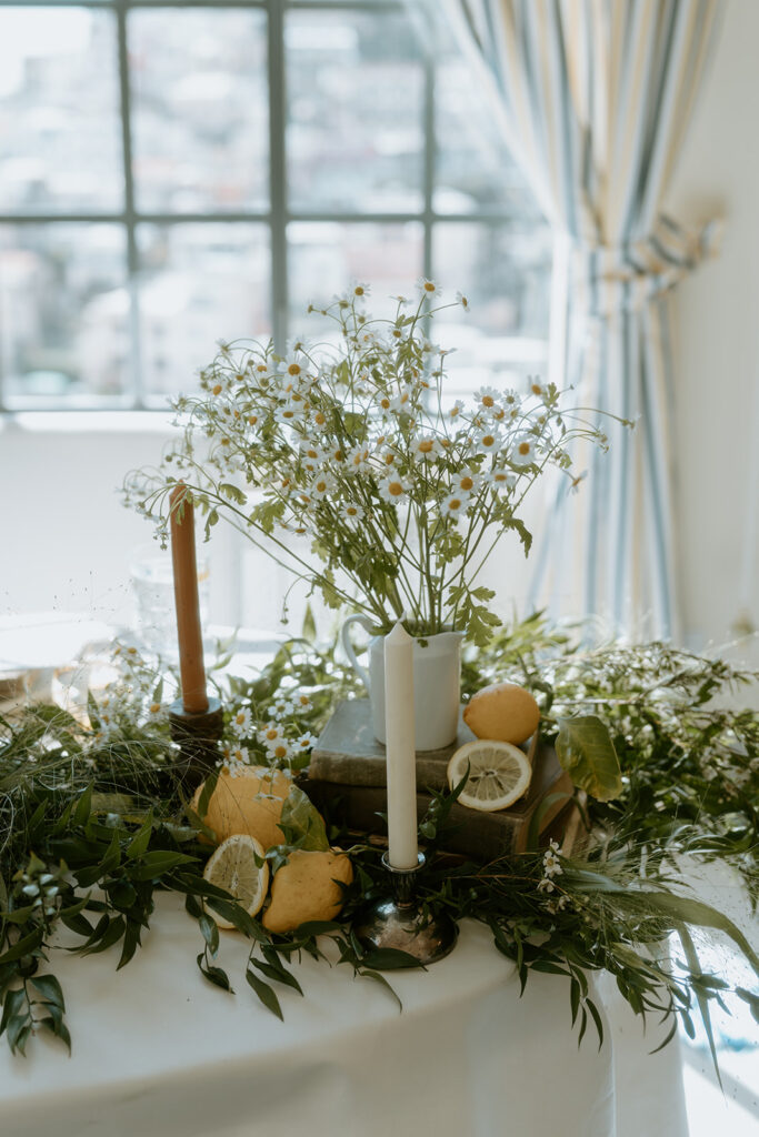 Lemon-themed table settings, adding a pop of yellow to the elegant wedding decor.