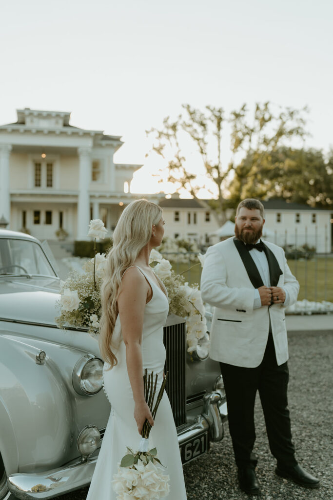 Vintage car prop enhances the Old Hollywood aesthetic in post-wedding photos at Moore Mansion, showcasing classic charm.