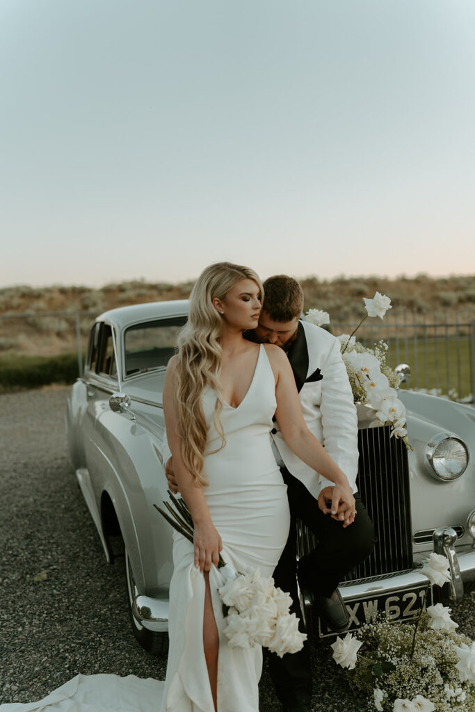 Vintage car prop enhances the Old Hollywood aesthetic in post-wedding photos at Moore Mansion, showcasing classic charm.