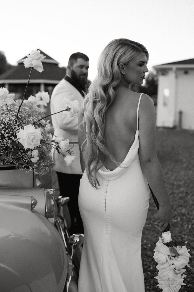 Elegant bride in a silk gown, showcasing Old Hollywood style at Moore Mansion in a timeless post-wedding photoshoot.