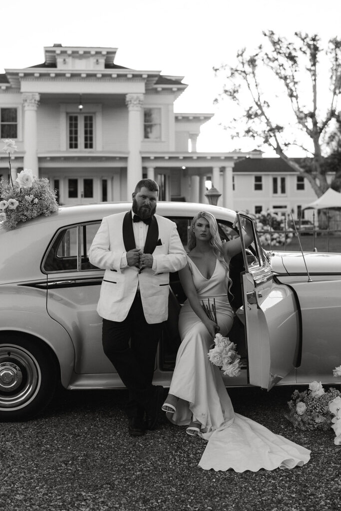 Vintage car prop enhances the Old Hollywood aesthetic in post-wedding photos at Moore Mansion, showcasing classic charm.