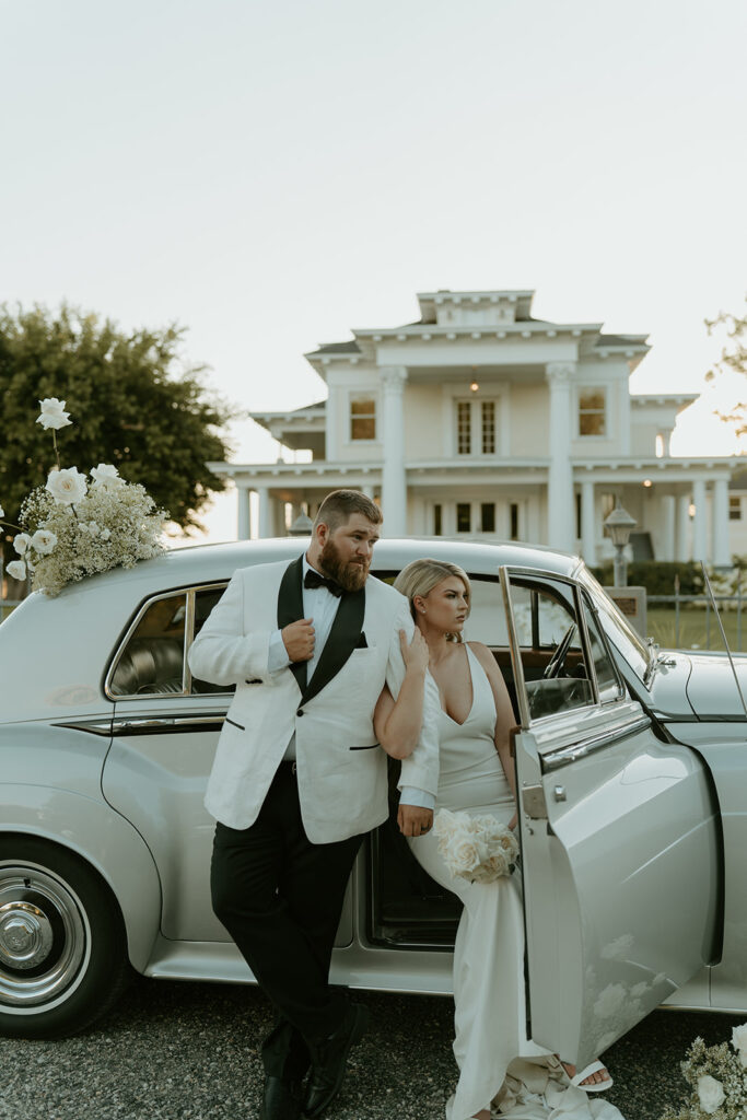 Vintage car prop enhances the Old Hollywood aesthetic in post-wedding photos at Moore Mansion, showcasing classic charm.