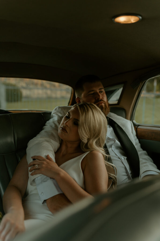 documentary style bride and groom in a vintage car