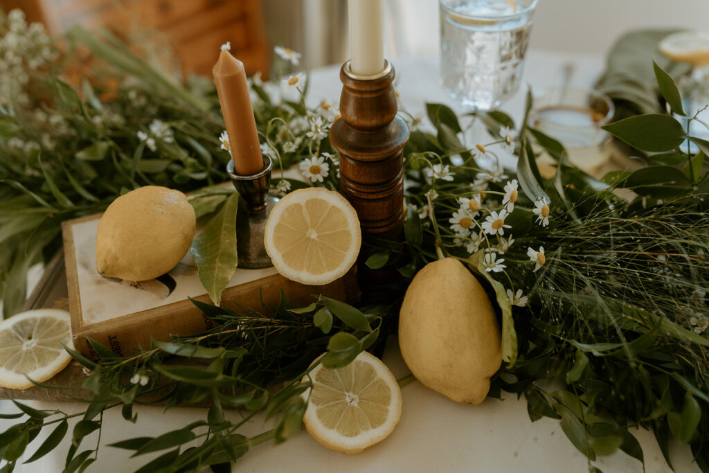 Lemon-themed table settings, adding a pop of yellow to the elegant wedding decor.