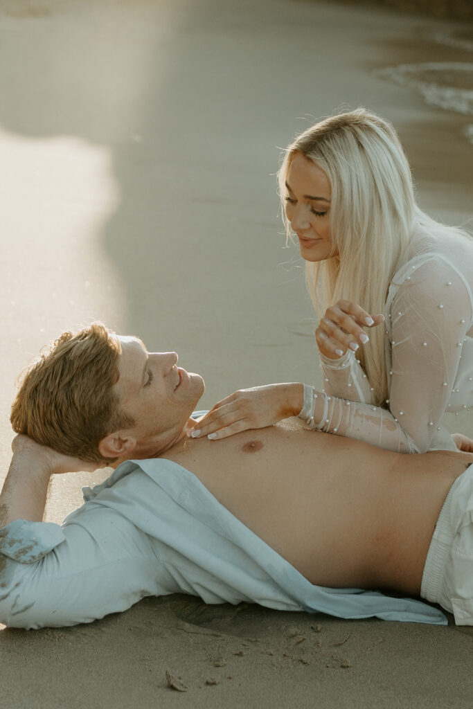 Playful Malibu engagement photos at sunrise